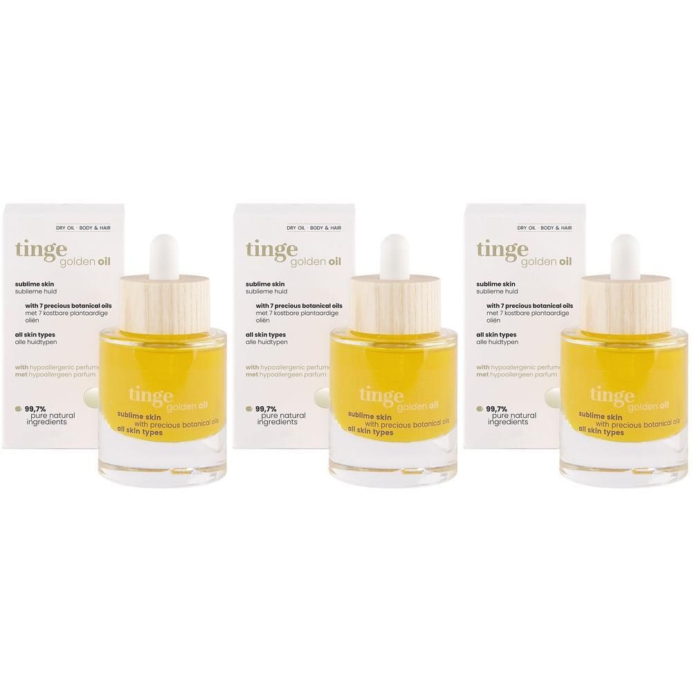 Drie flessen Tinge Golden Oil met pipetten en houten dopjes, naast hun kartonnen verpakkingen.