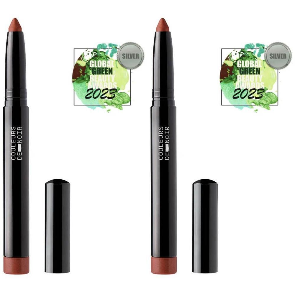 Twee zwarte lippenstiftstiften met dop, "COULEURS DE NOIR" opschrift en zilveren "GLOBAL GREEN BEAUTY AWARD 2023" zegel.