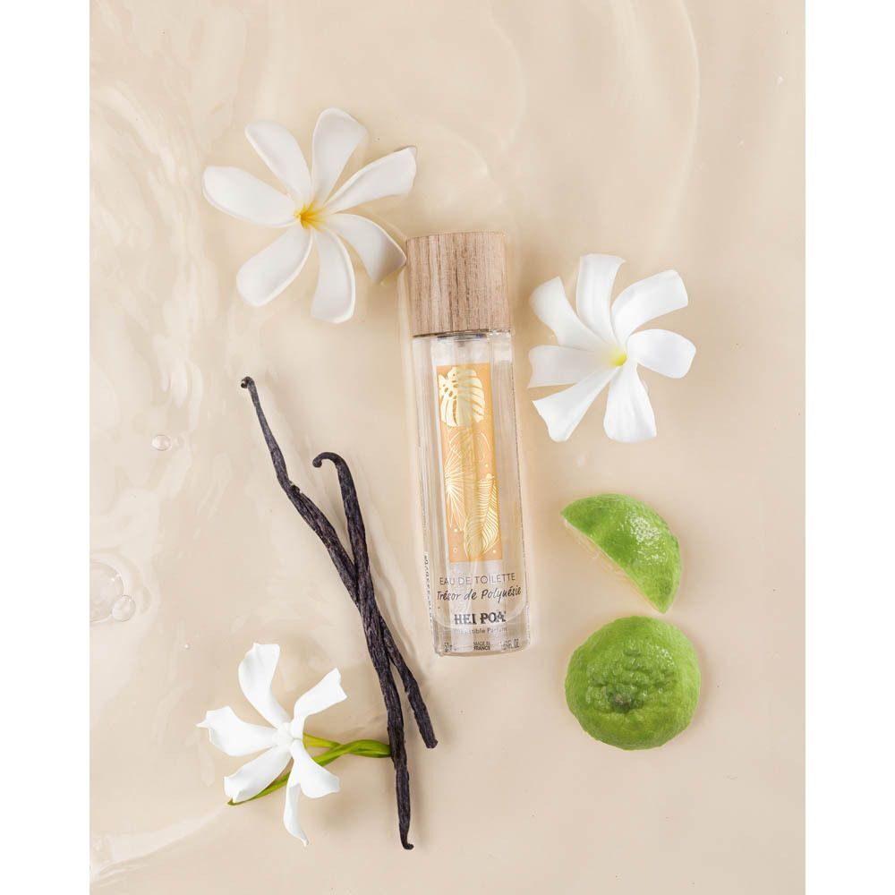 Un flacon d'Eau de Toilette Trésor de Polynésie avec des gousses de vanille et des fleurs.