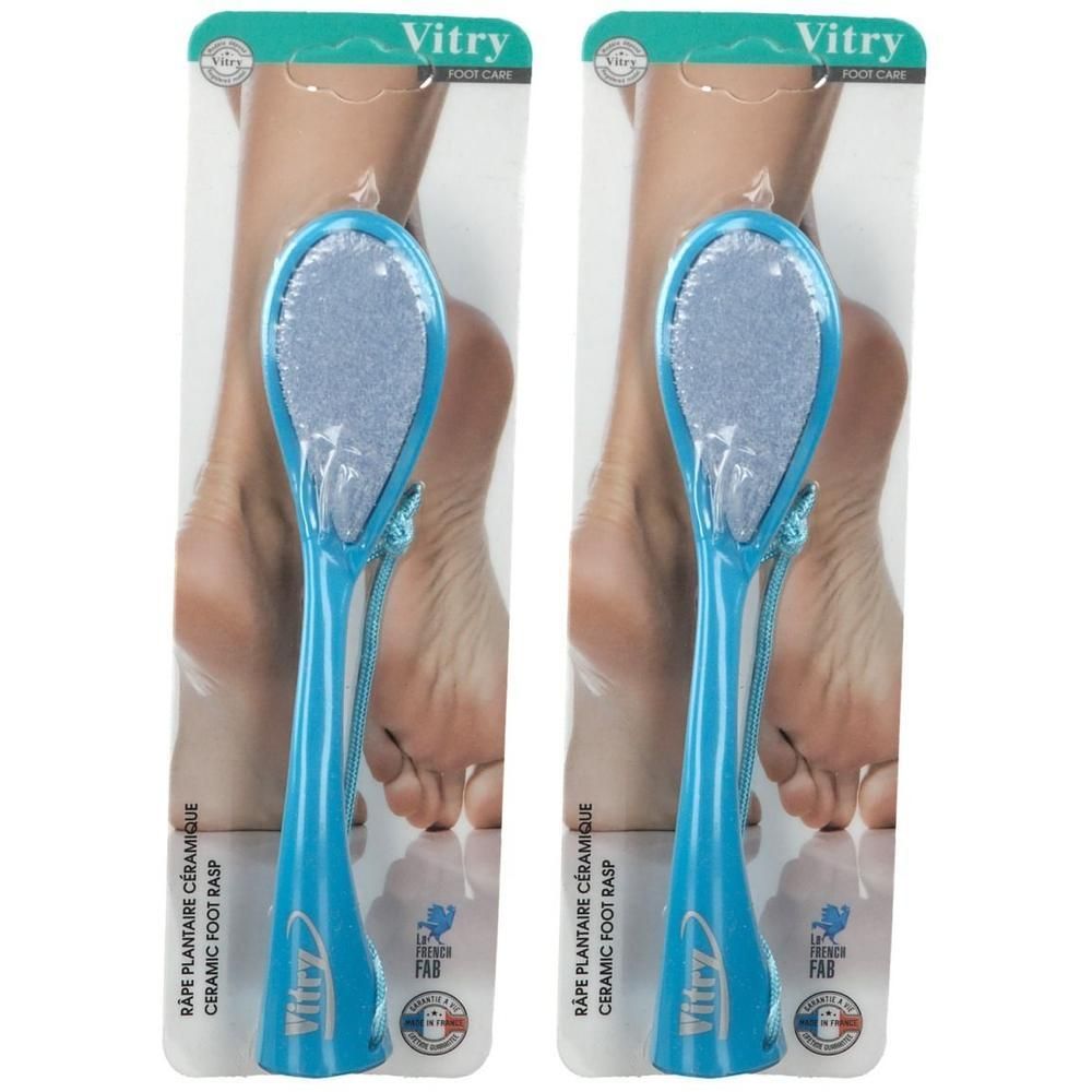 Deux râpes à pied en céramique bleues avec manche ergonomique et lanière, emballées.