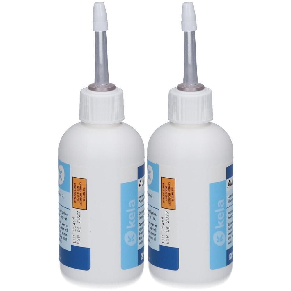 Twee witte flesjes met applicator-tuiten, gelabeld 'kela'.