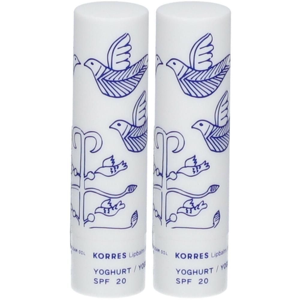 Twee witte lippenbalsem tubes met blauw vogelmotief en SPF 20 opschrift.