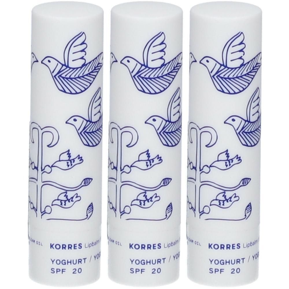 Drie witte lippenbalsemstiften met blauw vogelmotief en SPF 20 opdruk.
