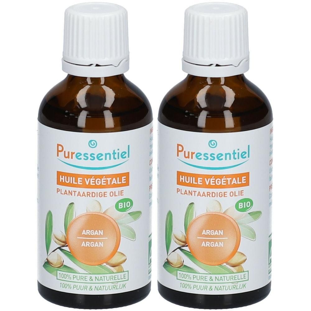 Deux flacons d'huile d'argan Puressentiel. Flacons en verre brun avec bouchons et étiquettes blancs.