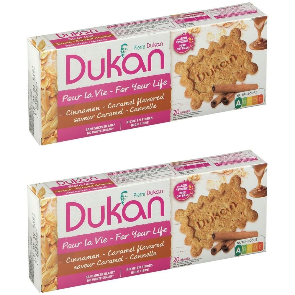 Twee pakken Dukan koekjes met karamel-kaneel smaak. Bevat 20 koekjes per pak.