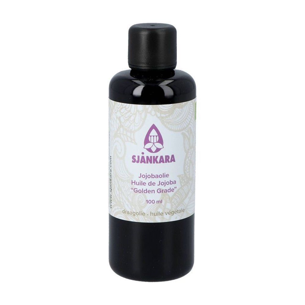 Un flacon d'huile de jojoba "Golden Grade" SjäNkara, 100 ml, avec étiquette et bouchon noir.