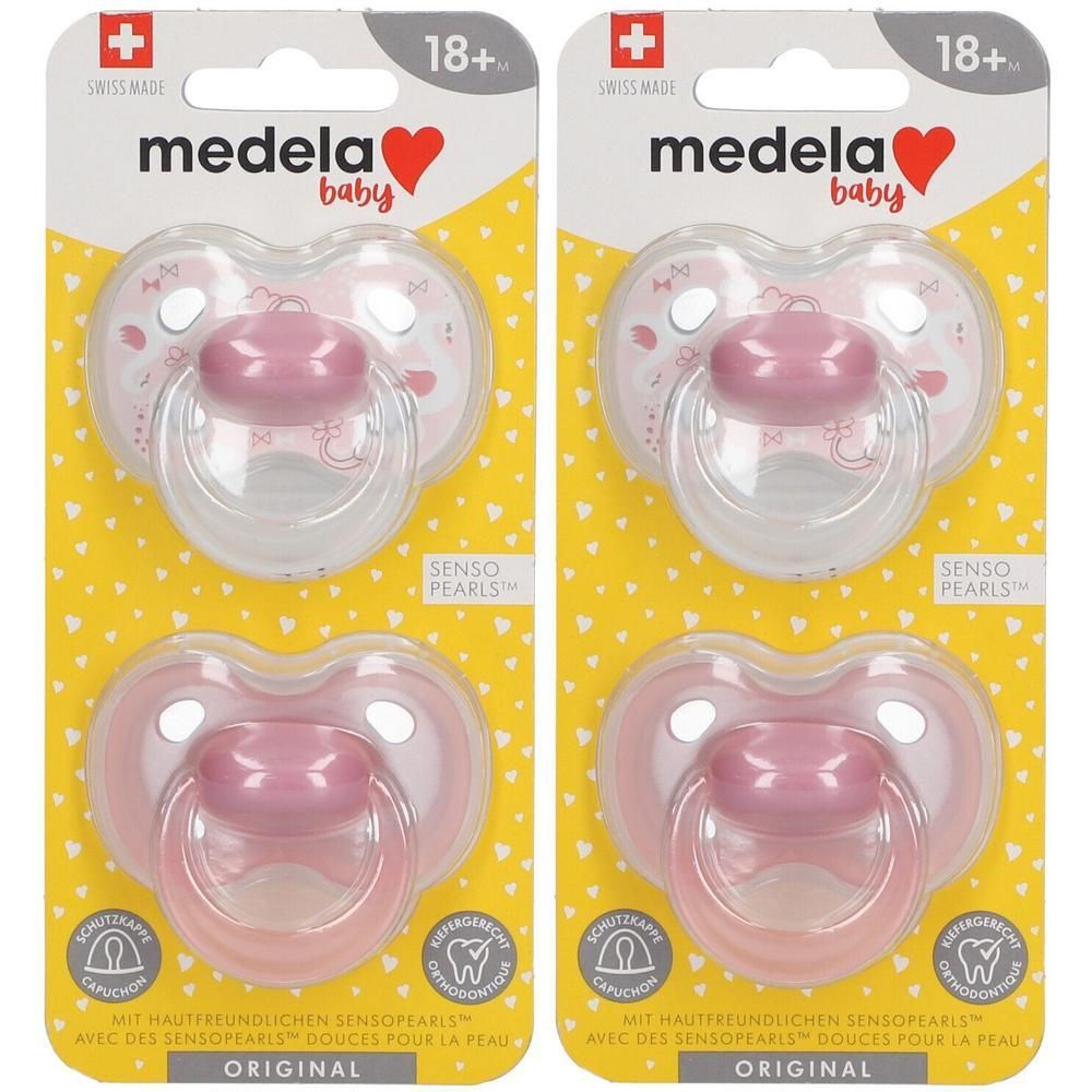 Twee Medela Baby fopspeen Roze, 18+ maanden, met beschermkap en orthodontisch ontwerp.