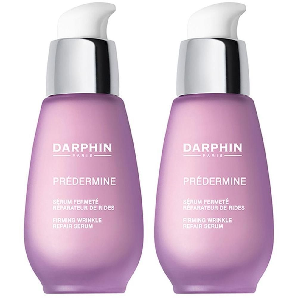 Deux flacons Darphin Prédermine avec pompes. Flacons violets en forme de goutte avec un col argenté.
