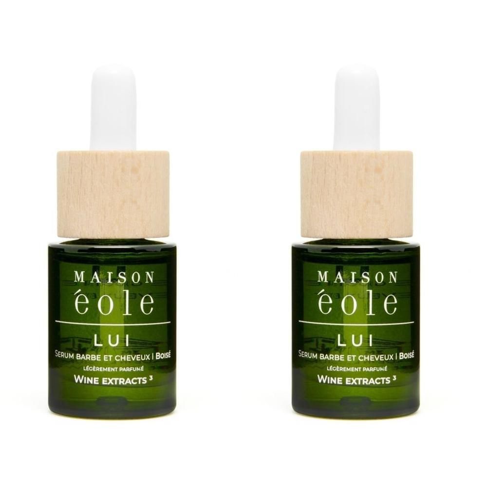 Twee groene glazen flesjes met houten dop en pipet. Etiket: Maison Éole, LUI, Baard- en Haarserum.