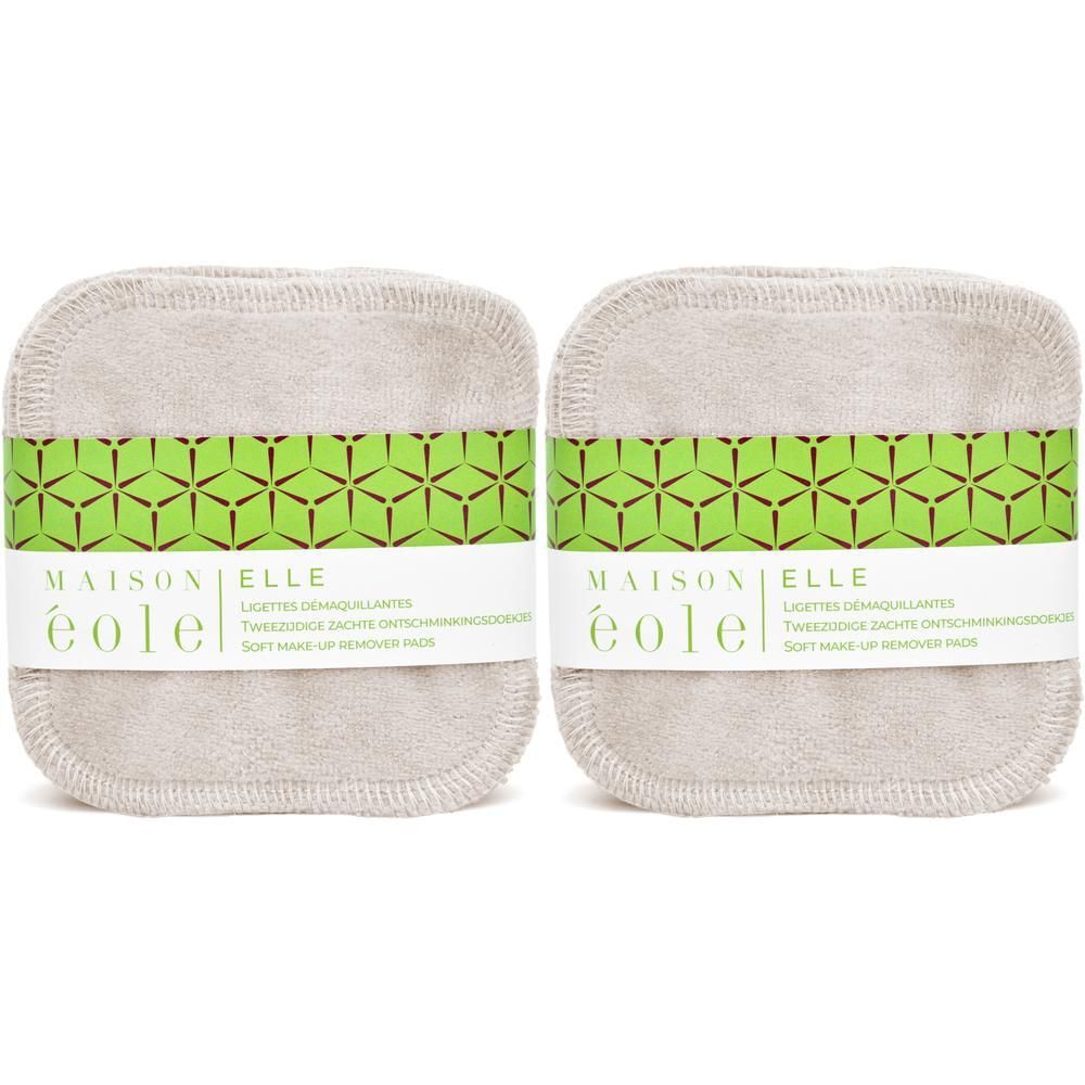 Twee zachte, herbruikbare make-up remover pads met groen geometrisch band.