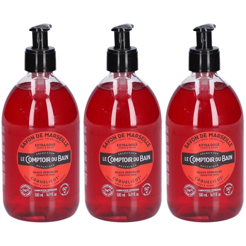 Drie flessen vloeibare zeep met dispenser, rode vloeistof, etiket met klaproos design.