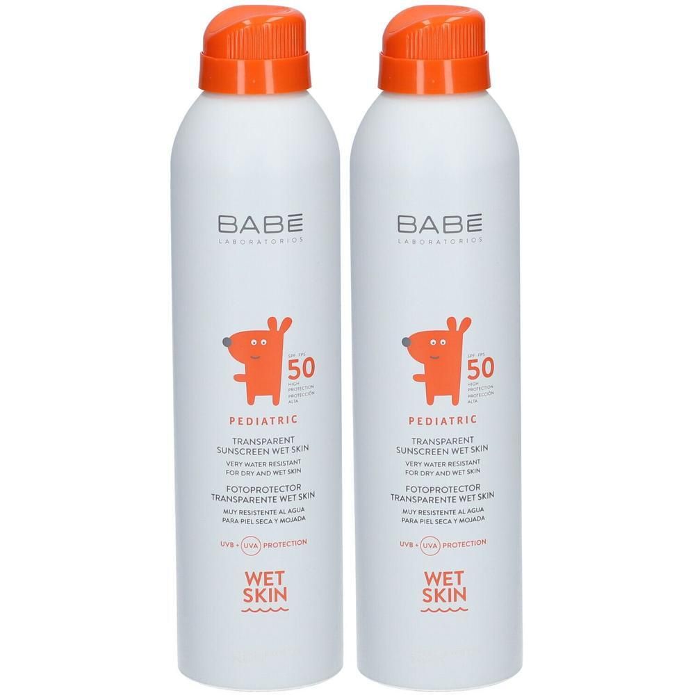 Deux sprays solaires BABÉ Pediatric SPF50 avec bouchons orange. Montre un chien orange.
