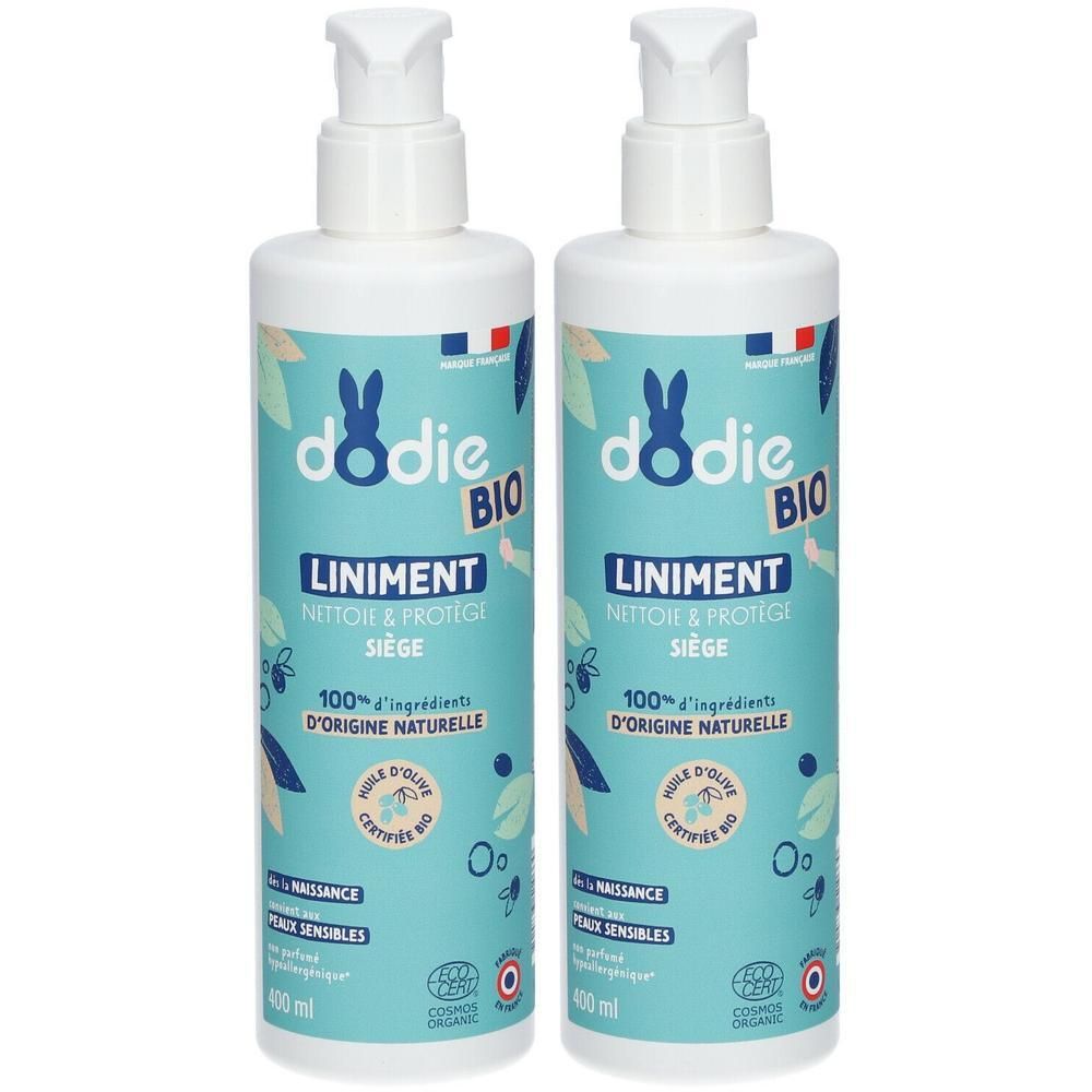Deux flacons de Liniment bio DODIE avec pompe. Étiquettes bleu clair avec logo lapin et motifs végétaux.