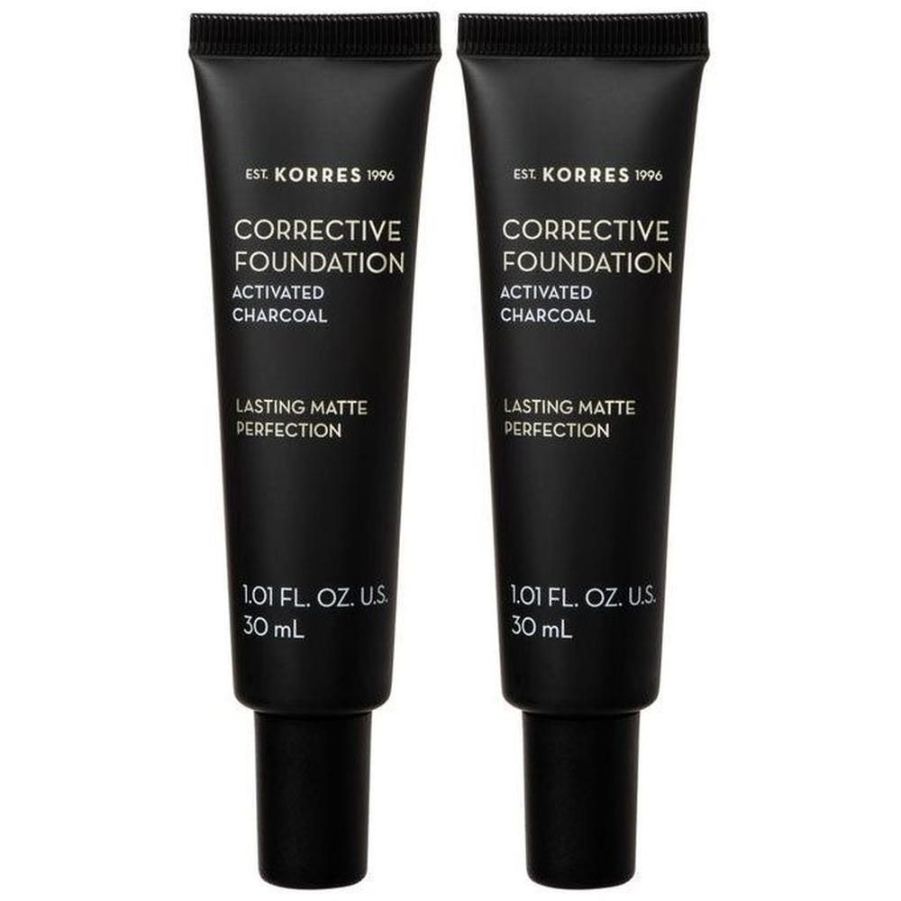 Twee zwarte tubes Korres Corrective Foundation met actieve kool, elk 30 ml.