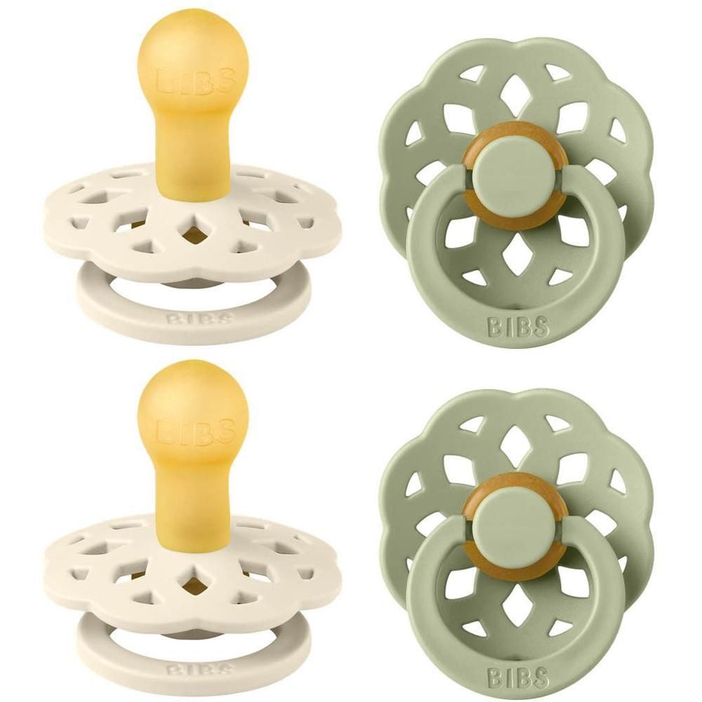 Twee BIBS spenen: één crème en één lichtgroen. Beide met gele speen en bloemenpatroon.