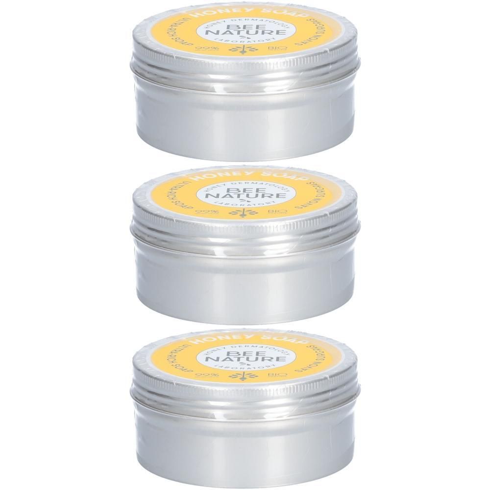 Trois boîtes rondes en métal de savon au miel Bee Nature.
