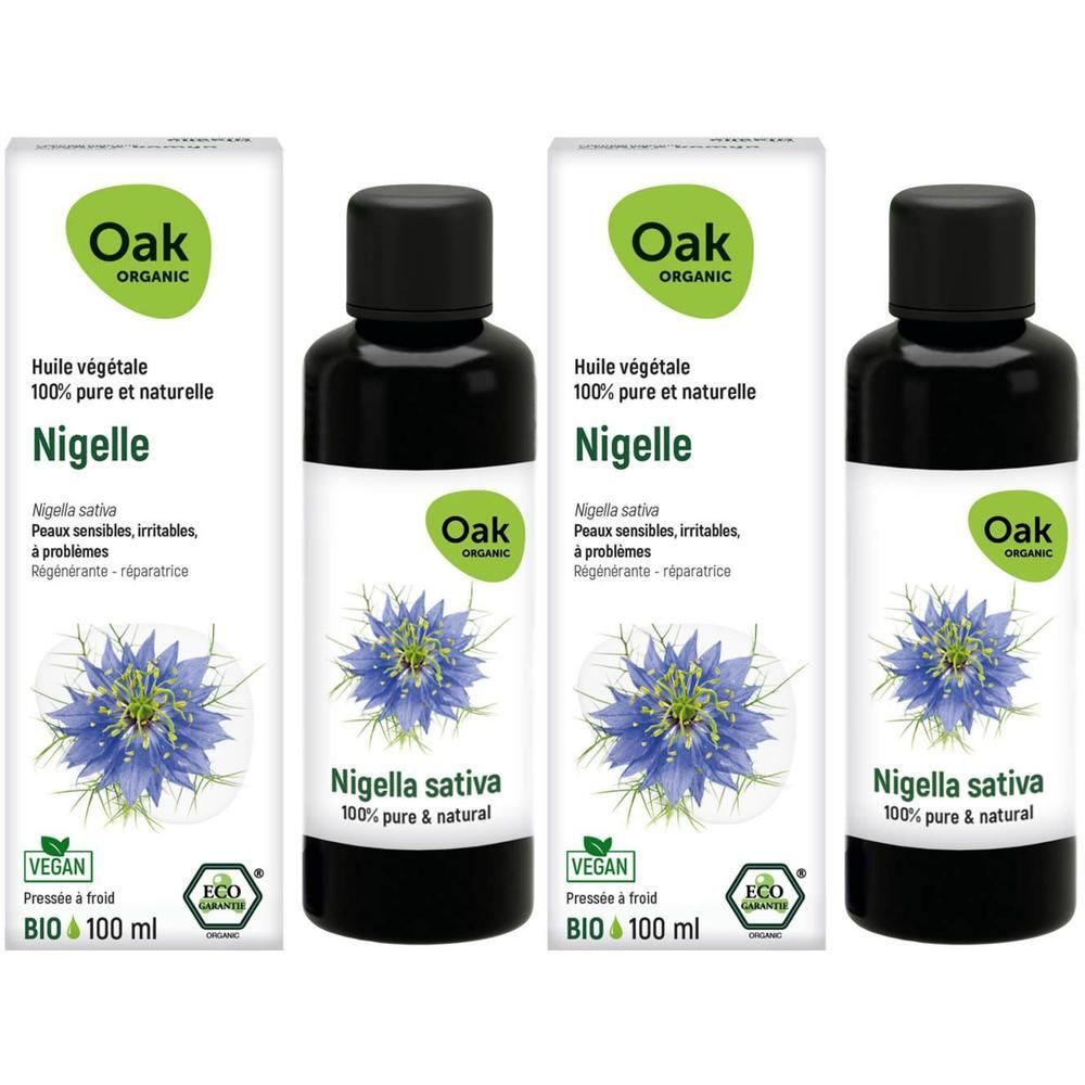 Trois flacons d'huile végétale Oak Nigelle, 100 ml, bouchon noir, étiquette avec fleur noire.
