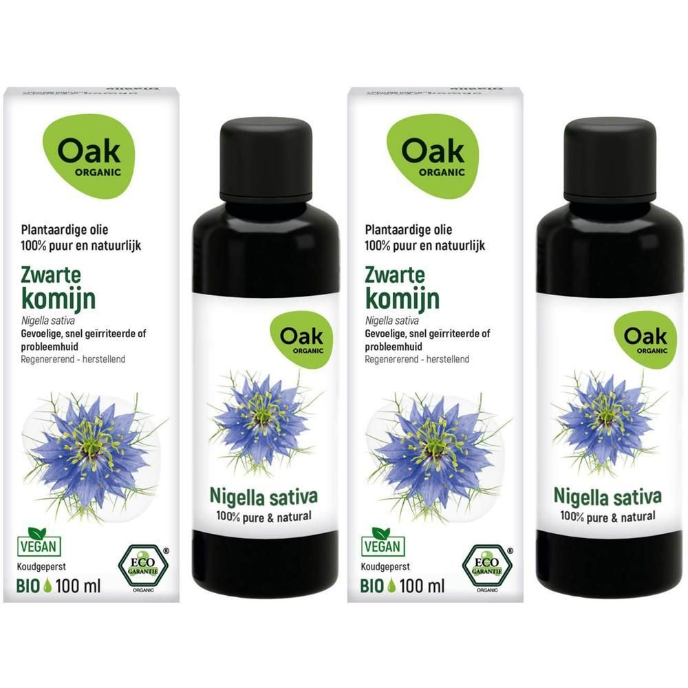 Drie flessen Oak Zwarte komijn plantaardige olie, 100 ml, met zwarte dop en etiket met zwarte bloem.