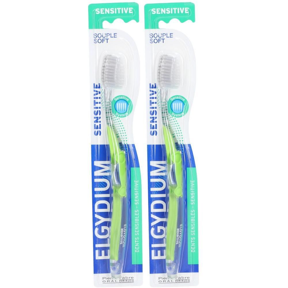 Twee Elgydium Sensitive tandenborstels, zacht, met groene handvatten en grijze borstelharen.