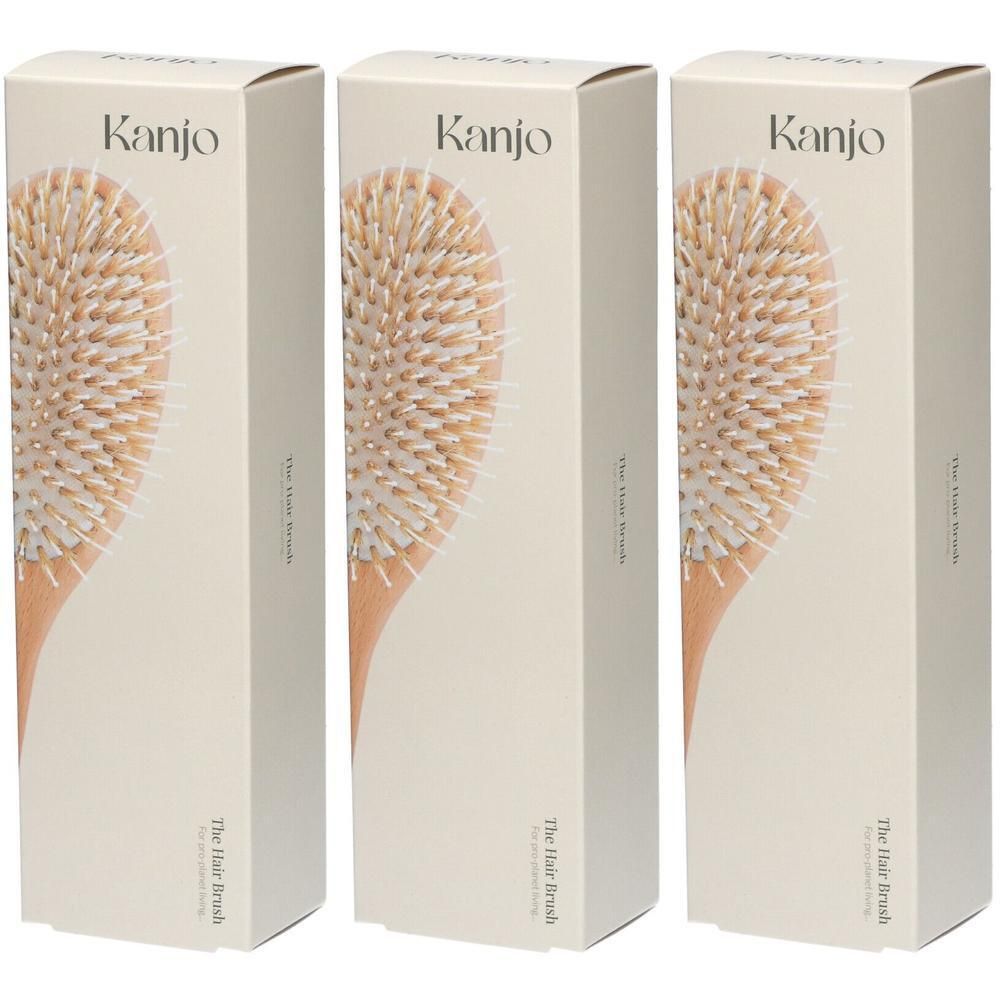Trois boîtes de brosses à cheveux Kanjo, montrant une image de brosse à cheveux.