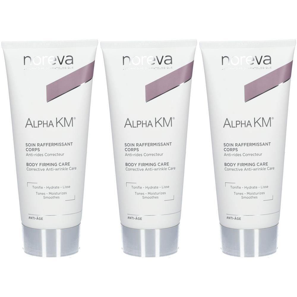 Trois tubes de soin corps Noreva Alpha KM avec bouchon argenté et accent violet.