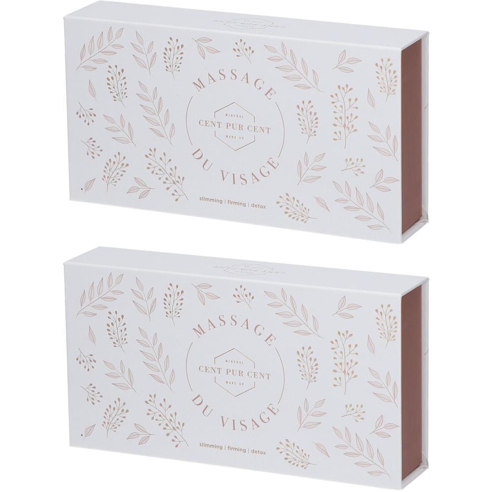 Witte geschenkdoos met bloemenpatroon en cirkelvormige opdruk 'Massage du Visage'.