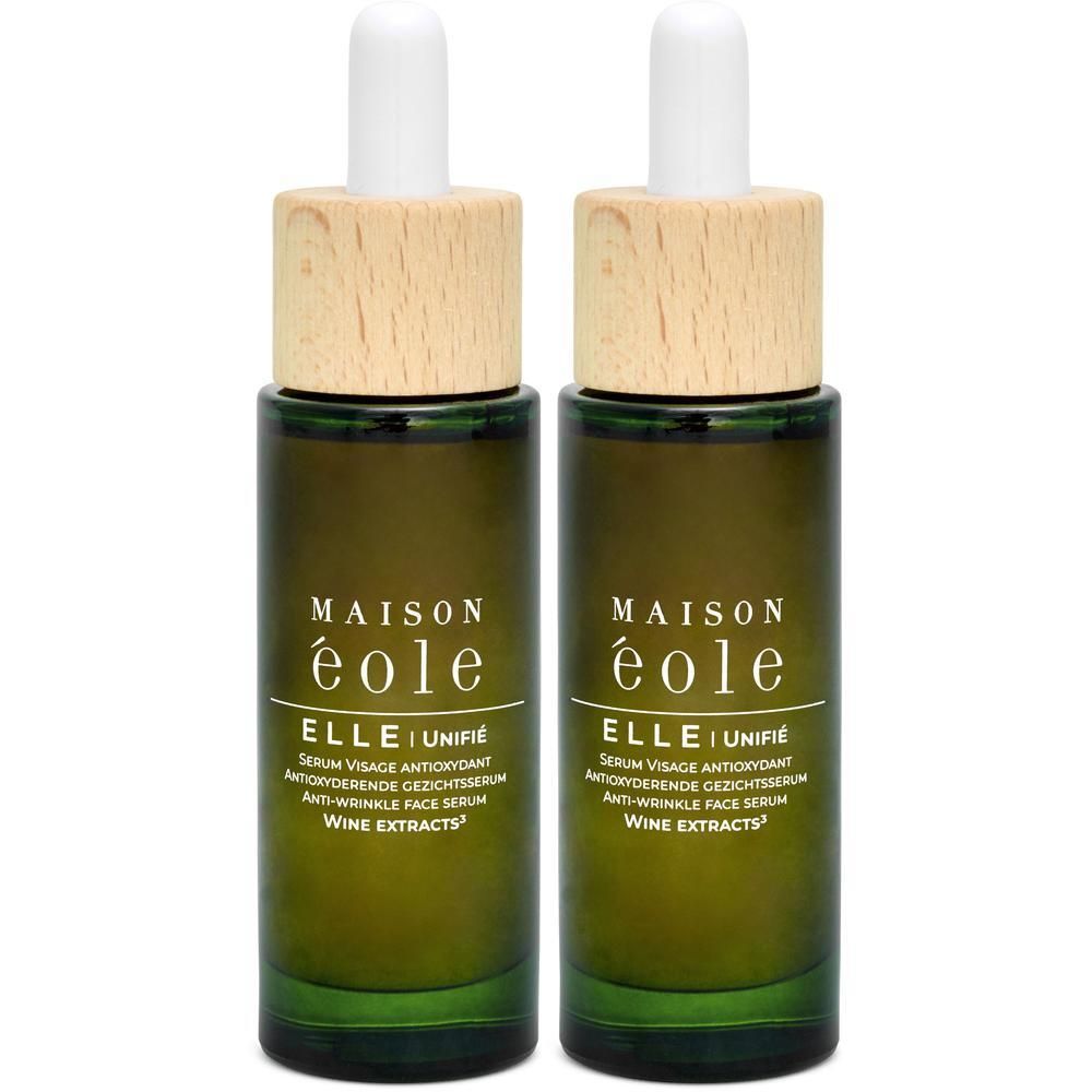 Twee groene glazen flesjes met pipetten en houten doppen, Maison Éole Sérum Visage Antioxydant.