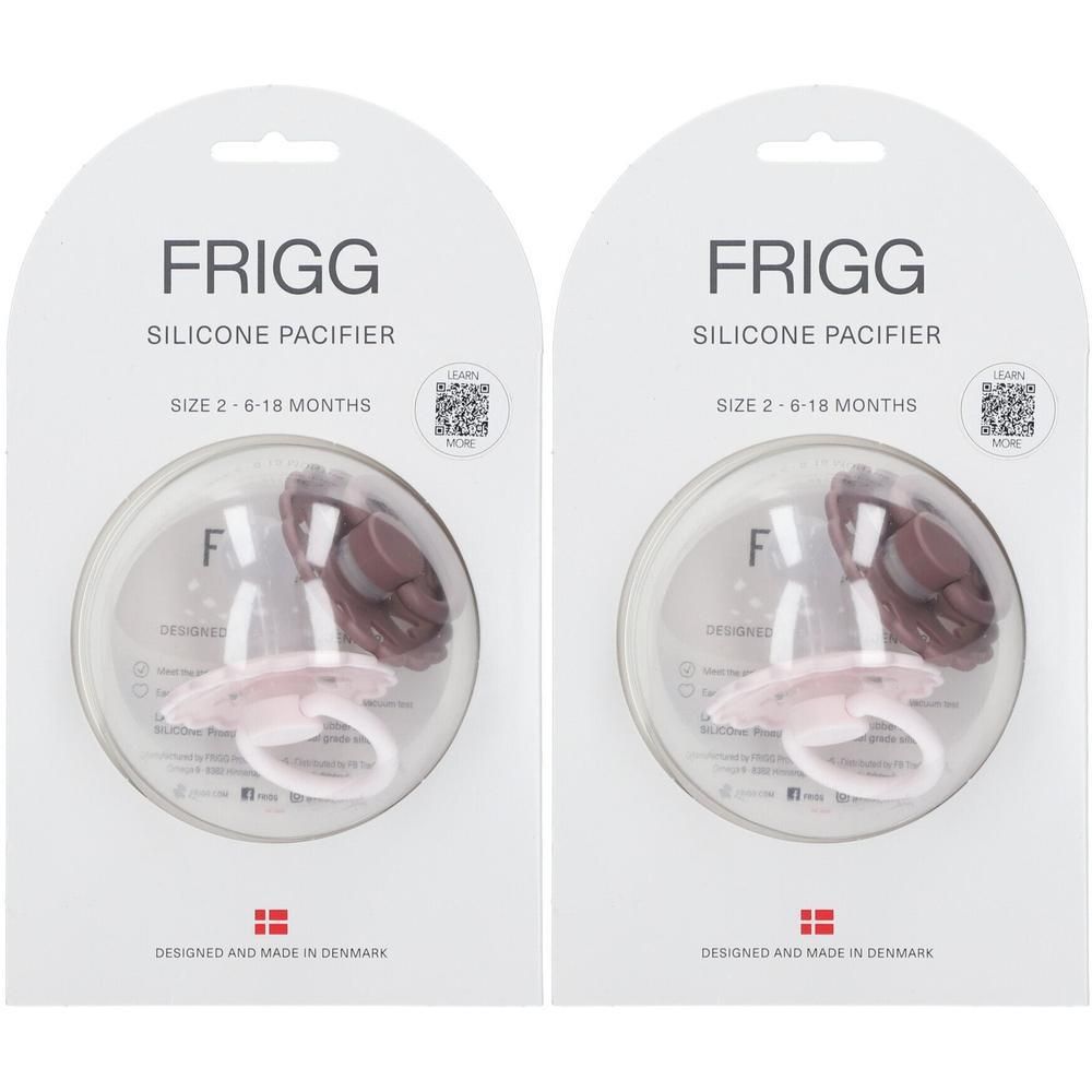 Deux sucettes FRIGG en silicone, rose et rose foncé, taille 2-6 mois, en emballage individuel.
