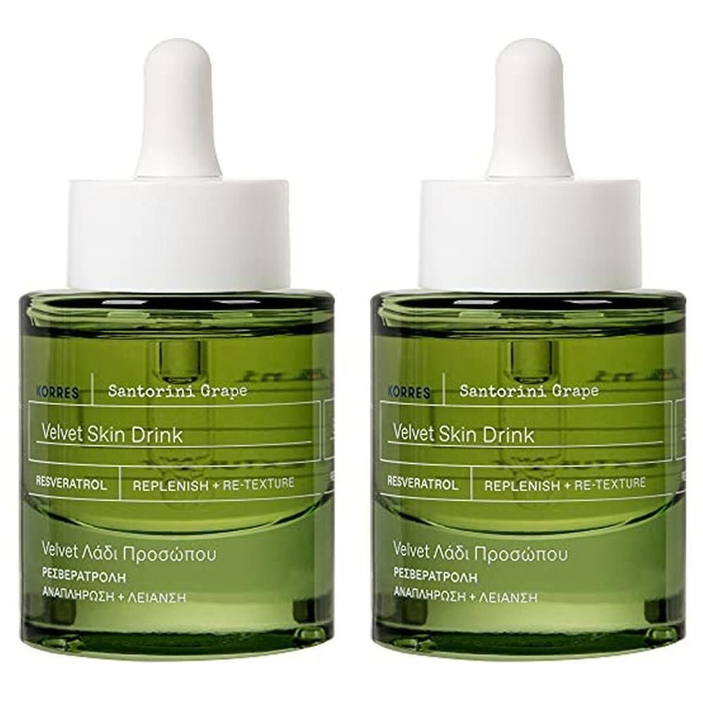Deux flacons de Korres Santorini Grape Velvet Skin Drink avec bouchon compte-gouttes.