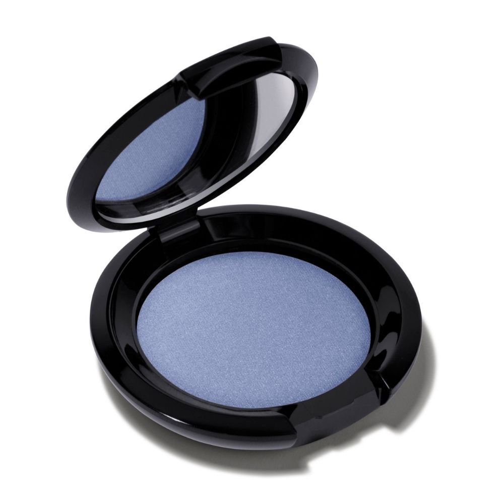 Un boîtier de fard à paupières ouvert avec miroir et fard bleu.