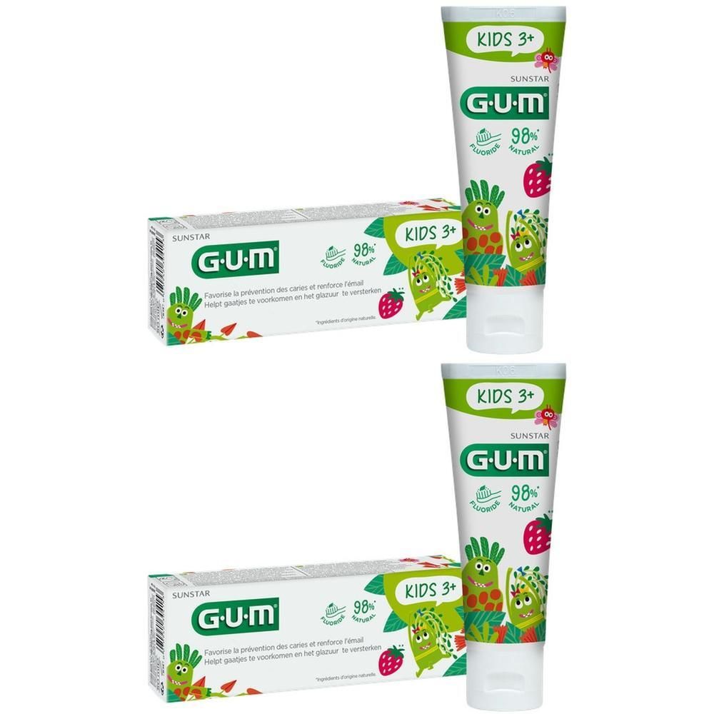 Twee tubes en doosjes GUM Kids tandpasta met fruit- en groentefiguren.