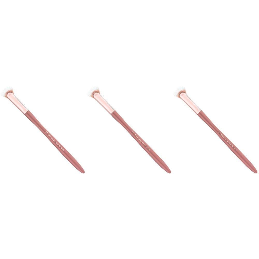 Trois brosses à mascara avec manches roses et têtes blanches.