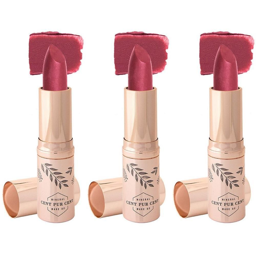 Drie roze lippenstiften met aangebrachte kleurstalen erboven. Gouden huls met bladdesign en merknaam.