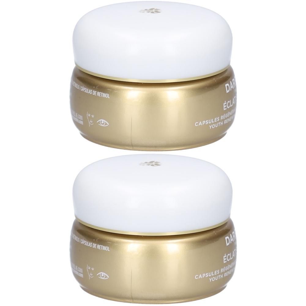 Twee gouden potjes met witte deksels, met Darphin Éclat Sublime capsules.