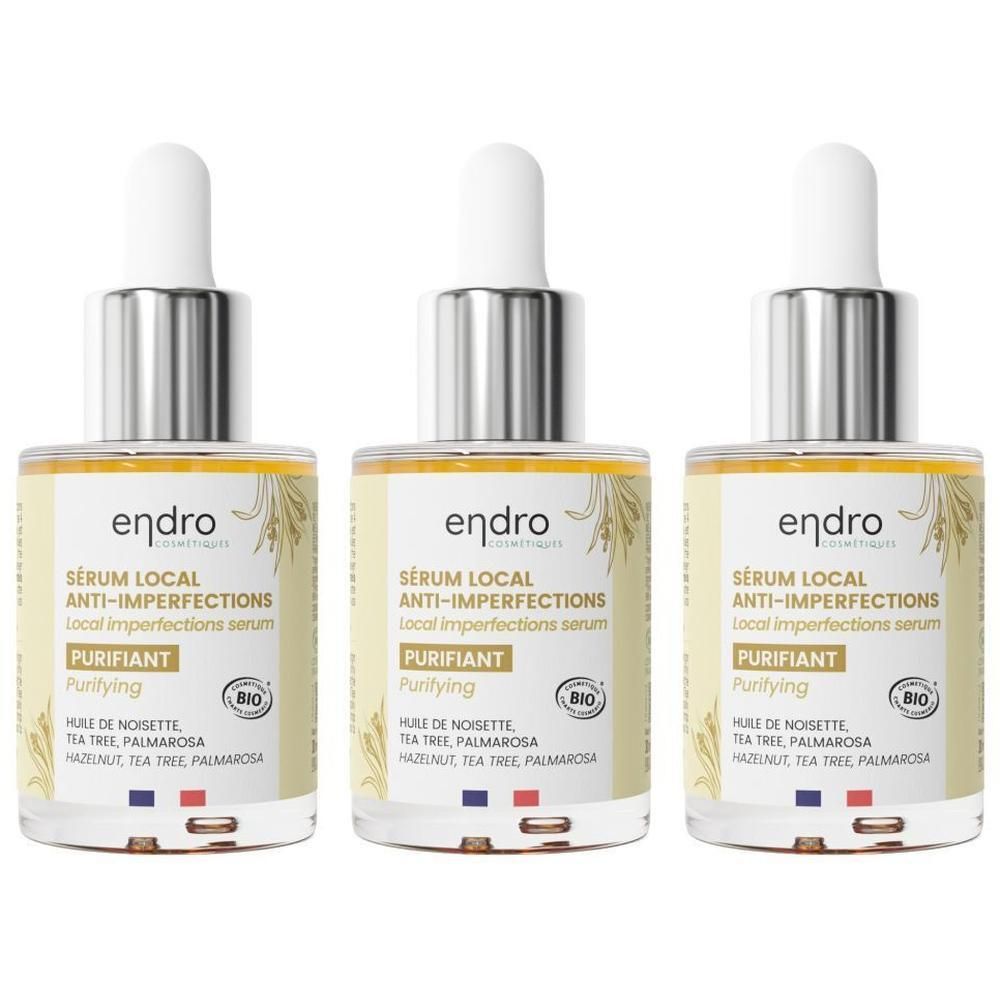 Trois flacons Endro Sérum Anti-Imperfections avec bouchon pipette. Liquide clair, étiquette jaune motif végétal.