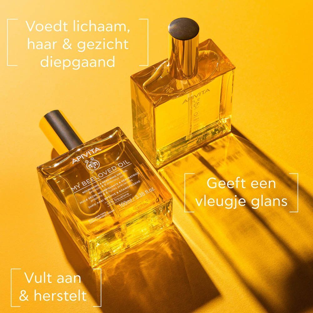 Vrouw houdt Apivita My Beeloved Oil vast. Resultaten: minder vochtverlies, gevoede huid.