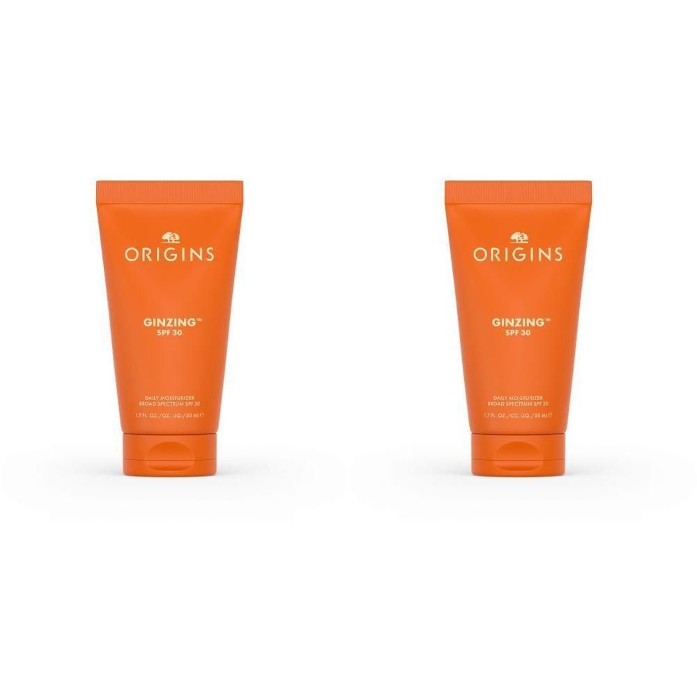 Twee oranje tubes Origins Ginzing dagelijkse vochtinbrenger SPF 30.