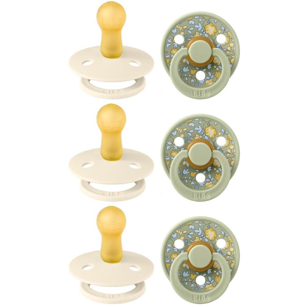 Drie crème en drie lichtgroene fopspenen met bloemenprint.