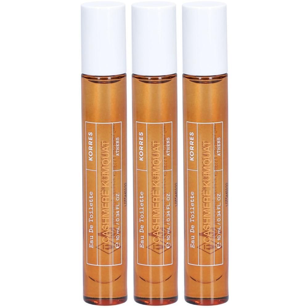 Drie Korres Eau de Toilette Cashmere Kumquat roll-on flesjes met witte doppen en oranje vloeistof.