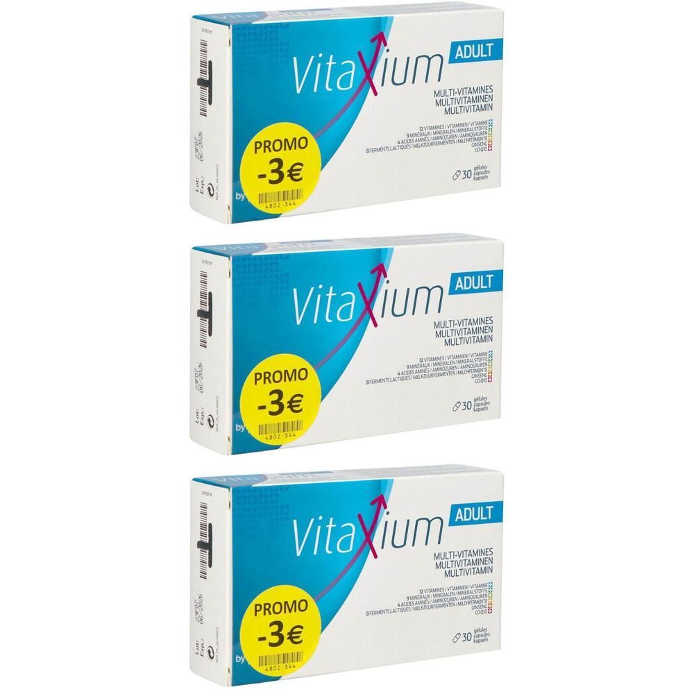 Trois boîtes de Vitaxium Adult Multivitamines 30 capsules, chacune avec un autocollant "Promo -3€".