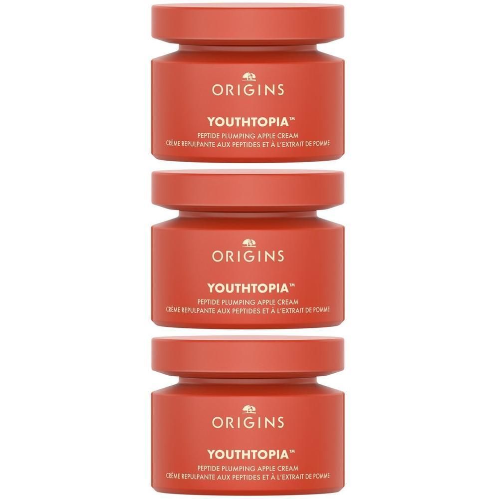 Trois pots rouges de Crème Repulpante aux Peptides et à l'Extrait de Pomme Origins Youthtopia.