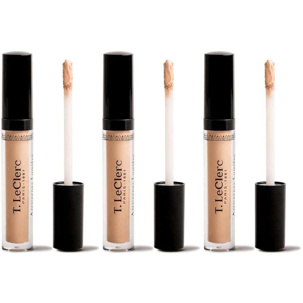 Trois correcteurs T.Leclerc avec capuchons noirs et applicateurs. Flacons transparents révélant un contenu beige clair.
