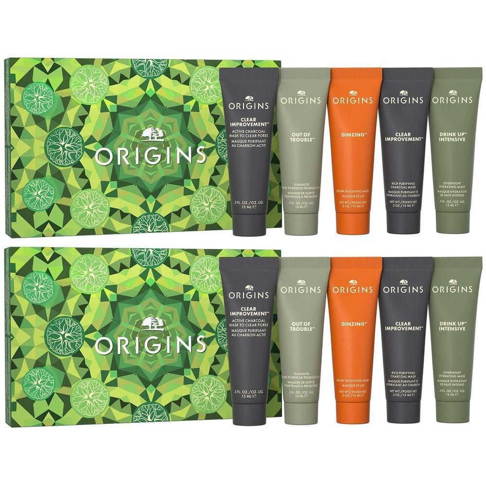 Deux coffrets cadeaux Origins contenant chacun cinq tubes de crème pour le visage de différentes couleurs et tailles.