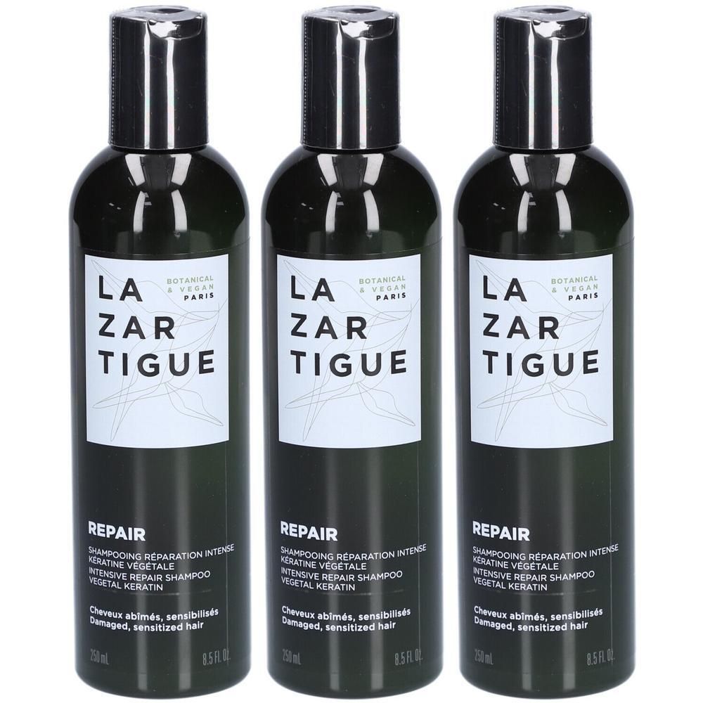 Drie flessen Lazartigue Repair Shampoo met plantaardige keratine voor intensieve reparatie.