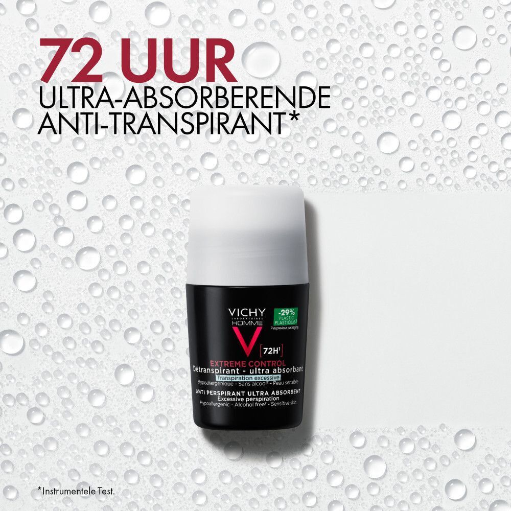 Een Vichy Homme deodorantroller op een achtergrond met waterdruppels.