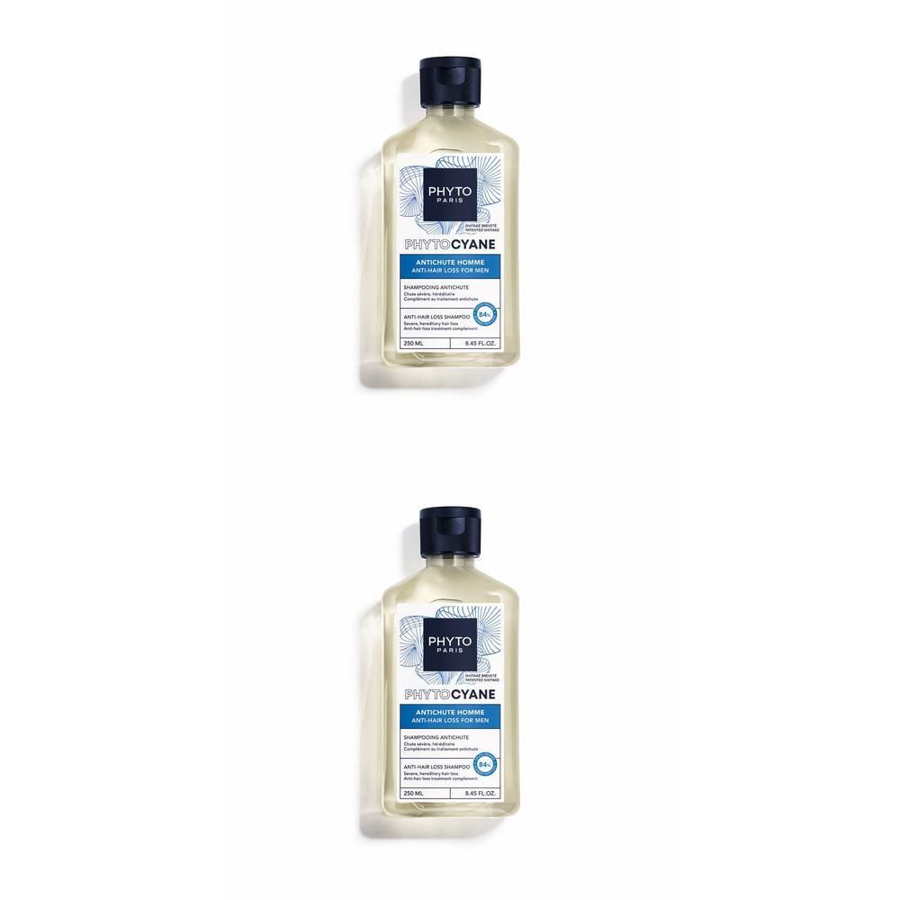 Deux flacons de shampooing Phytocyane. Liquide clair dans des bouteilles transparentes avec étiquettes bleues et bouchons noirs.