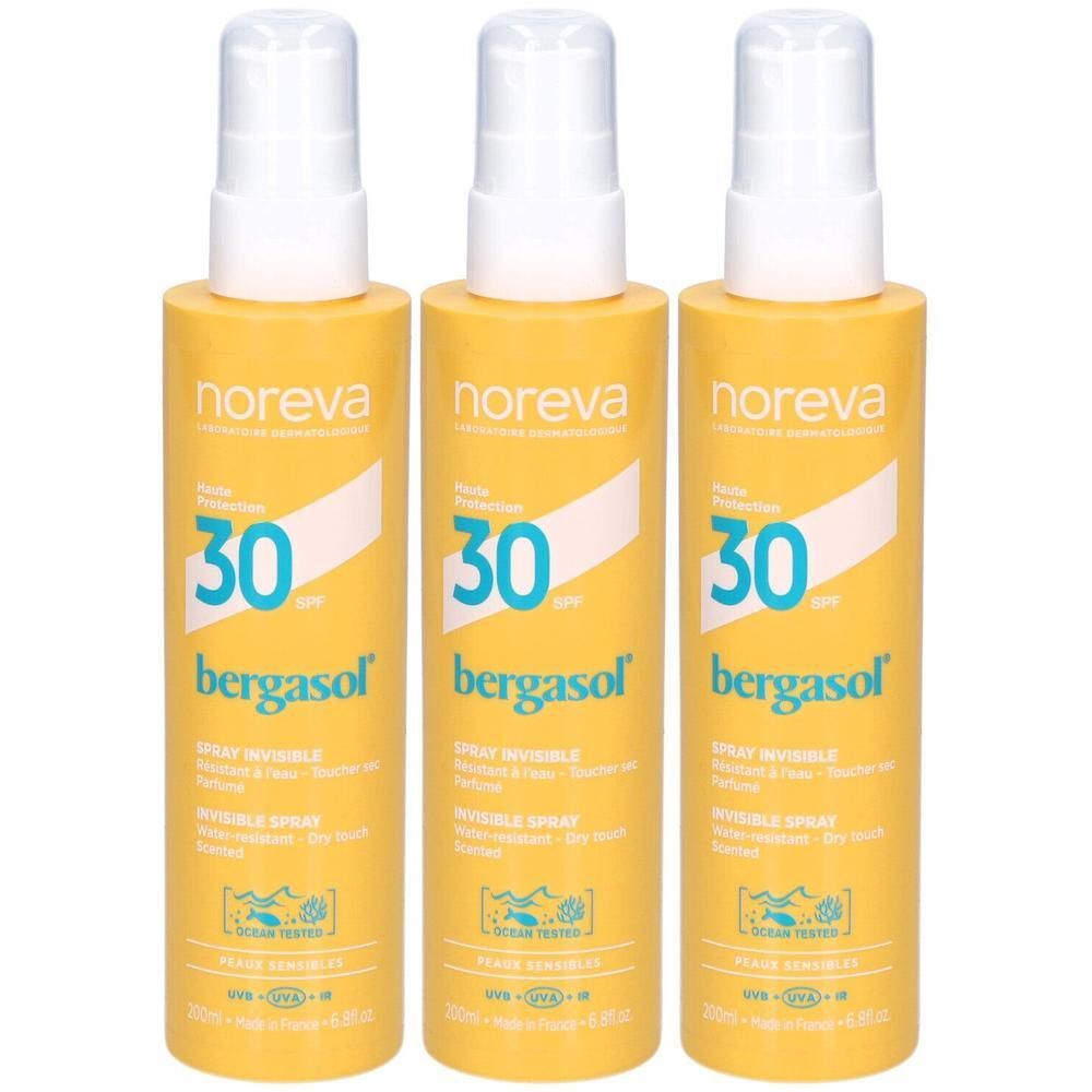 Drie gele sprayflessen Noreva Bergasol SPF 30 onzichtbaar.