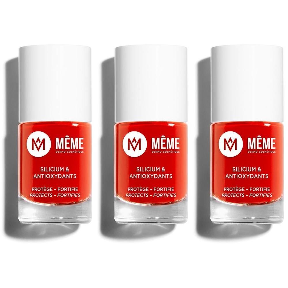 Drie flesjes oranje nagellak met witte dop. Merk MÊME.