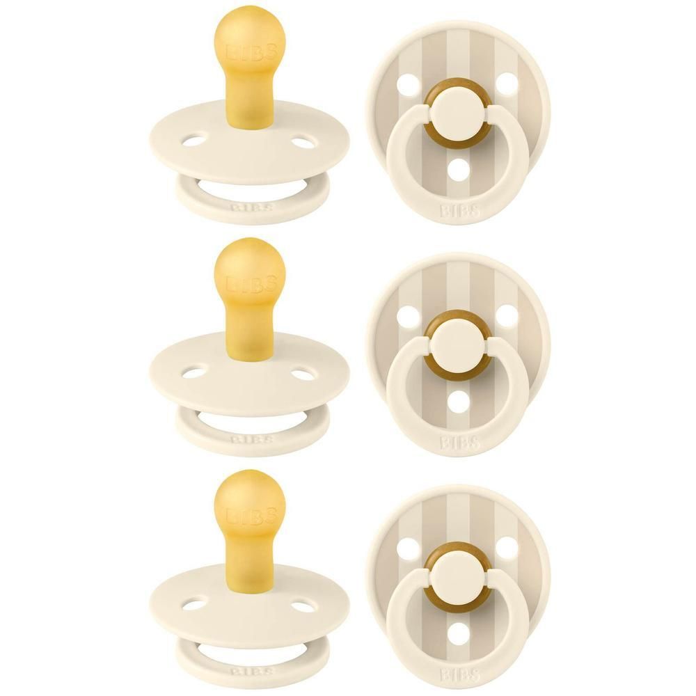 Deux tutelles BIBS crème avec tétine jaune et motif rayé.