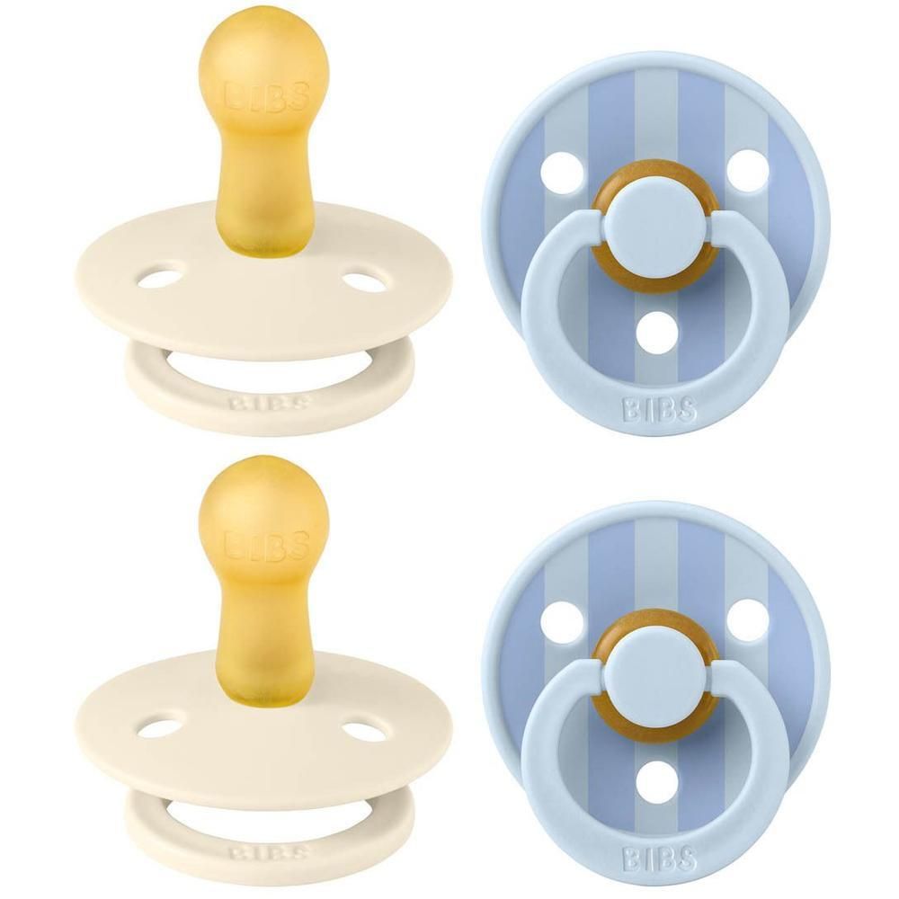 Deux sucettes BIBS : une couleur crème, une rayée bleu clair. Tétines en caoutchouc naturel jaune.